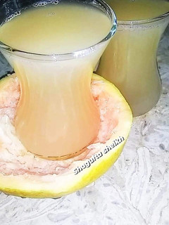 A picture of Fresh and healthy grapefruit juice.