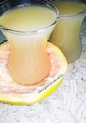 A picture of Fresh and healthy grapefruit juice.