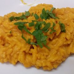 A picture of Yellow risotto with pumpkin mousse, the rice of witch.