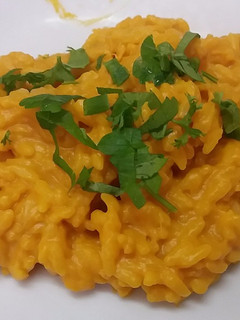 A picture of Yellow risotto with pumpkin mousse, the rice of witch.