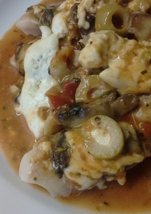 Una foto de Merluza a la pizza