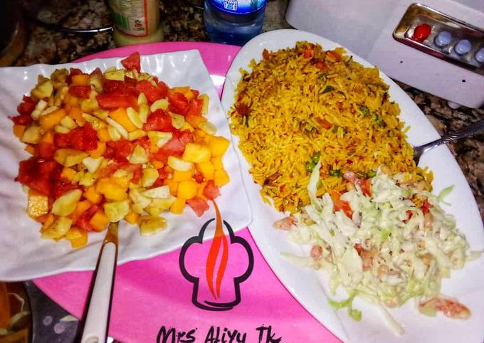 Yummy Food Mexican Cuisine Jalof rice with coleslow and fruits salad