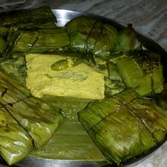 A picture of Steamed Pointed gourd in banana leaf.