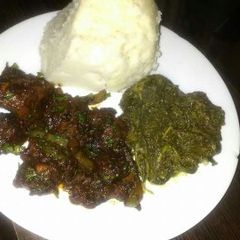 A picture of Fried pork with Ugali.