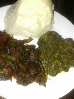 A picture of Fried pork with Ugali.