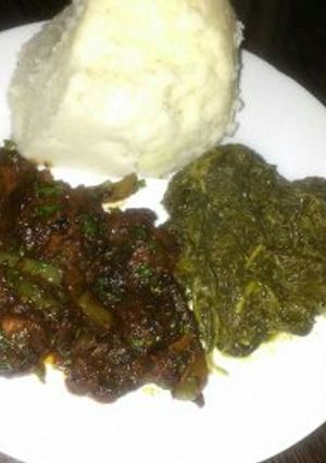 A picture of Fried pork with Ugali.