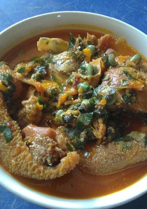 A picture of Spicy Ofe Achi with Assorted Goat Meat.