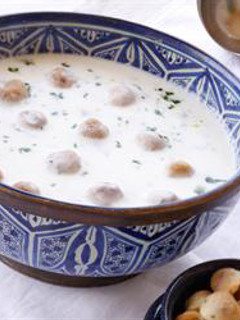 A picture of Meat dumplings in hot yogurt sauce - shish barak.