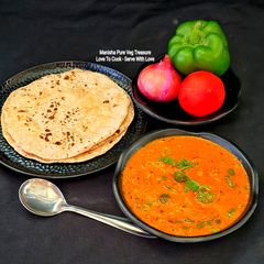 A picture of Capsicum-Onion Curry in a Yogurt-Based Red Gravy.