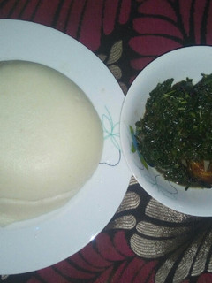 A picture of Vegetable soup and casava and corn flour amala.