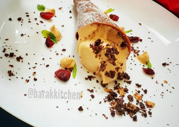 The Secret of Successful Cappuccino Mousse served with Chocolate cone and cookie crumbs