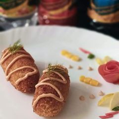 Chicken cutlet roll with sauce A picture of Chicken cutlet roll with sauce.