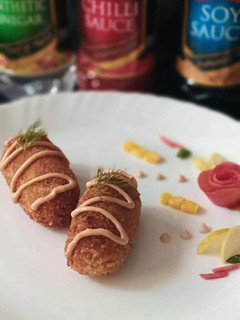 A picture of Chicken cutlet roll with sauce.
