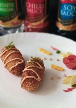 A picture of Chicken cutlet roll with sauce.