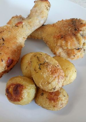 A picture of Thyme and Parmesan crusted chicken and new potatoes.