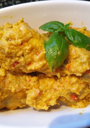 A picture of Chicken in coconut and turmeric sauce.