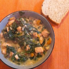 A picture of Spinach and Salmon with parmesan sauce.