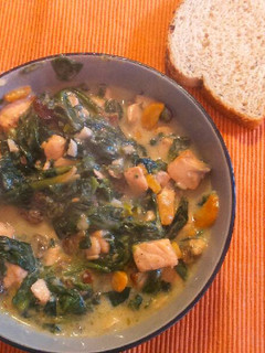 A picture of Spinach and Salmon with parmesan sauce.