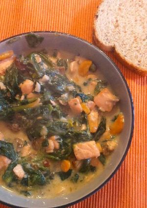 A picture of Spinach and Salmon with parmesan sauce.
