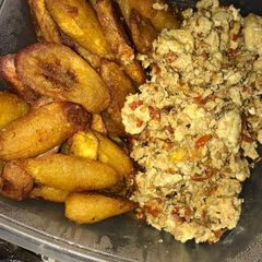 A picture of Title:egg sauce and fried plantain.