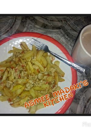 A picture of Fried potatoes and scrambled egg.