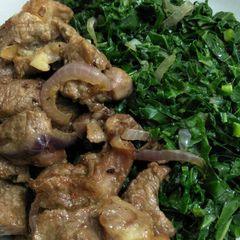 A picture of Fried mutton with greens.