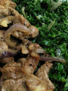 A picture of Fried mutton with greens.