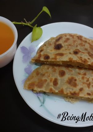 A picture of Aloo Stuffed Paratha- Tomato Soup.