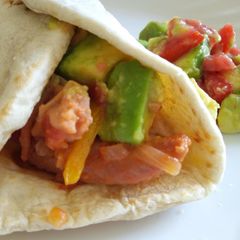 A picture of Sausage and avocado salad tortillas.