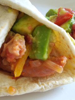 A picture of Sausage and avocado salad tortillas.