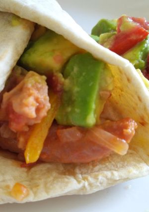 A picture of Sausage and avocado salad tortillas.