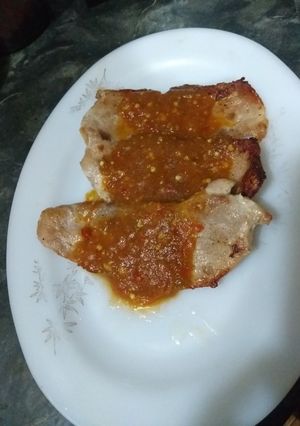 Una foto de Milanesa de puerco en salsa