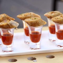 A picture of Spring rolls with shots.