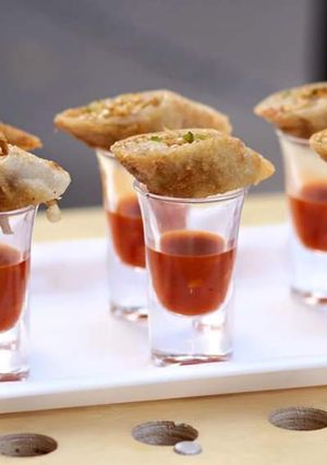 A picture of Spring rolls with shots.