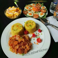 A picture of Couscous wt cabbage sauce nd salad.