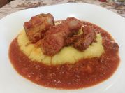 A picture of veal with tomato sauce