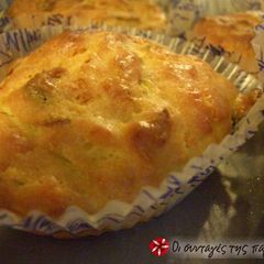 A picture of Muffins with zucchinis.