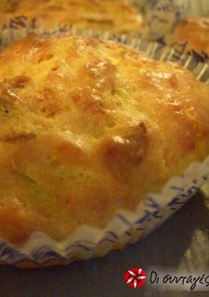 A picture of Muffins with zucchinis.