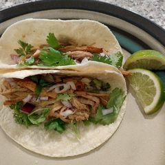 A picture of Carnitas tacos.