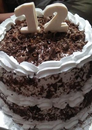 A picture of Two tier vanilla and chocolate cake 🎂.