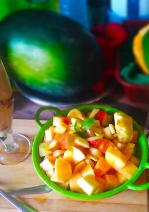 A picture of Fruit Salad with Cocoa milk.