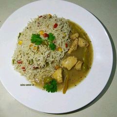 A picture of Lemon chicken with fried rice.