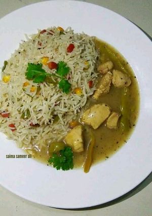 A picture of Lemon chicken with fried rice.