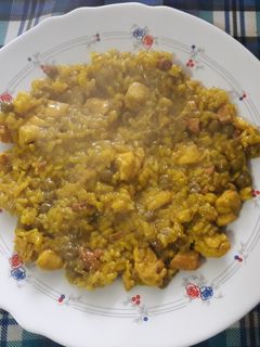 Una foto de Arroz con pollo y lomo adobado