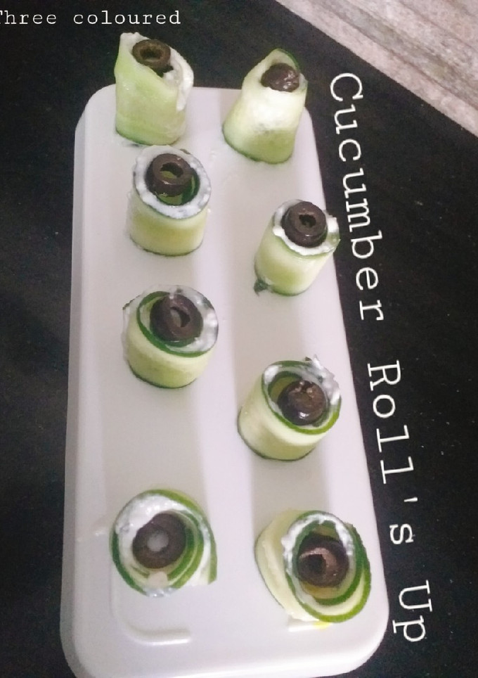 A picture of Three coloured Cucumber Roll's Up.
