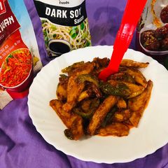 A picture of Dragon potatoes with carrots and capsicum.