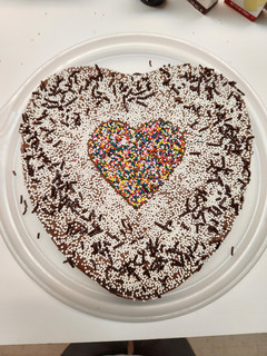 A picture of Valentines Strawberry Cake with Chocolate icing.