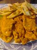 Filetes de pollo empanados con patatas al horno