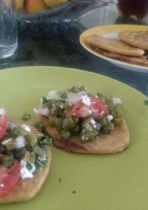 A picture of Tlacoyos with Nopal Salad.