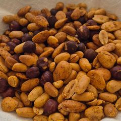 A picture of Hot roasted nuts in airfryer.